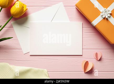Happy Mother's Day modern greeting card mockup blank paper with envelope, flowers and gift on a wooden table. Flat lay view of elegant postcard backgr Stock Photo