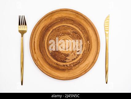 Brown clay plate isolated on white, top view Stock Photo