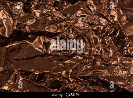Abstract texture pattern metallic paper using as a background or wallpaper. Metal aluminum foil shiny and reflector Stock Photo