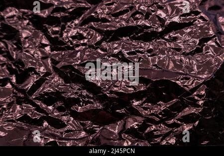 Abstract texture pattern metallic paper using as a background or wallpaper. Metal aluminum foil shiny and reflector Stock Photo