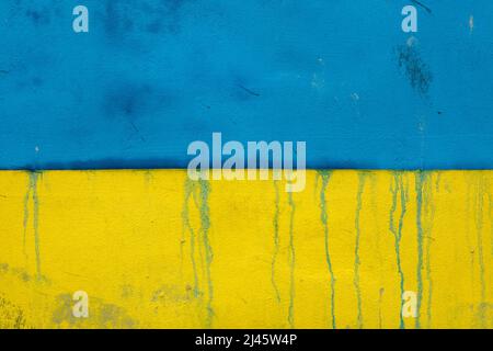 Ukrainian national flag depicted on the wall in Prague, Czech Republic. The huge flag was depicted to support Ukrainian refugees in the Czech Republic and to protest against the Russian invasion of Ukraine in 2022. Stock Photo