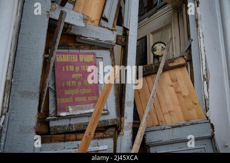 CHERNIHIV, UKRAINE - APRIL 11, 2022 - The knocked-out doors of a library damaged as a result of shelling by Russian troops are pictured in liberated Chernihiv, northern Ukraine. Photo by Kotenko Yevhen/Ukrinform/ABACAPRESS.COM Stock Photo