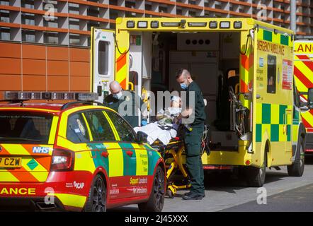London, UK. 12th Apr, 2022. A steady stream of patients arrive at the Royal London Hospital in Whitechapel. With high Covid numbers, 1 in 13 people with the virus, the NHS is under severe pressure over the Easter period. The NHS is also suffering from staff shortages. Credit: Karl Black/Alamy Live News Stock Photo