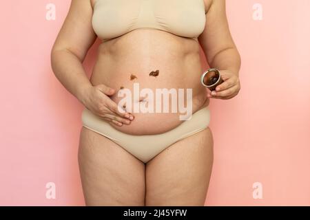 Cropped Overweight Woman in Underwear Applying Moisturizer Cream Lotion To  Her Abdomen. Belly Fat Removal. Postnatal Stock Image - Image of adiposity,  firmness: 245775333