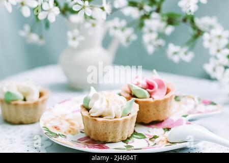Cake on the background of the cherry blossoms Stock Photo