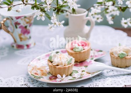 Cake on the background of the cherry blossoms Stock Photo