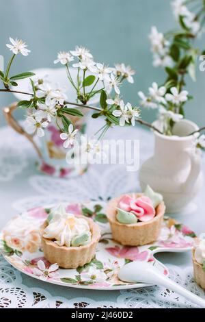 Cake on the background of the cherry blossoms Stock Photo