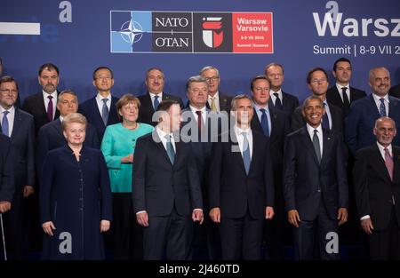 Participants of the NATO summit pose for a group photo in Warsaw Stock ...