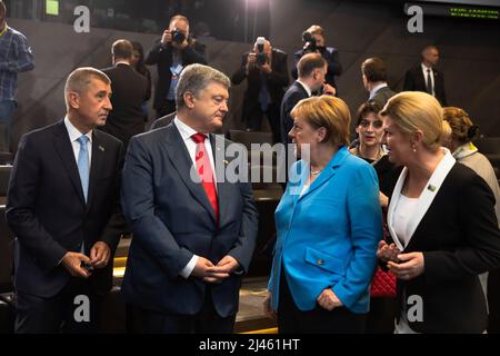 Brussels, Belgium. 12th July, 2018. Ukrainian President Petro Poroshenko and German Chancellor Angela Merkel seen during NATO military alliance summit in Brussels. (Photo by Mykhaylo Palinchak/SOPA Images/Sipa USA) Credit: Sipa USA/Alamy Live News Stock Photo