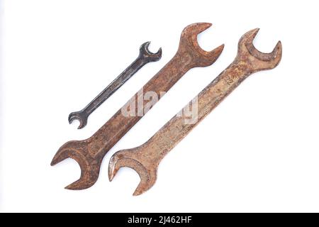 Set of different old dirty wrenches isolated on white background. Top view Stock Photo