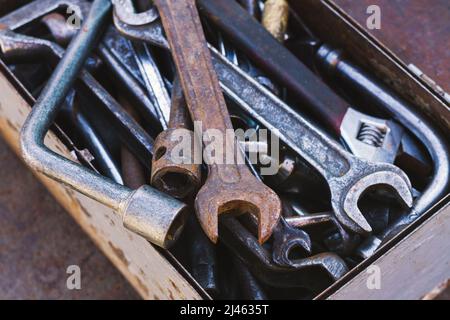 Toolbox of different dirty old hand tools close-up Stock Photo