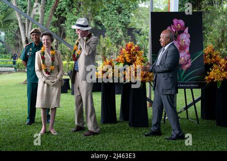 The Princess Royal and Vice Admiral Sir Tim Laurence are shown a photograph of an Orchid named Vanda The Princess Royal during a visit to the Adventure Park PNG in Port Moresby, on day two of the royal trip to Papua New Guinea on behalf of the Queen, in celebration of the Platinum Jubilee. Picture date: Tuesday April 12, 2022. Stock Photo