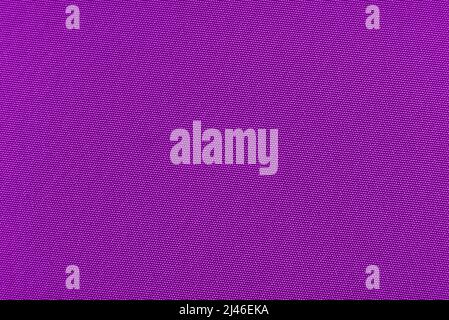 Violet or magenta fabric. Background from colored material. Texture of red color Stock Photo