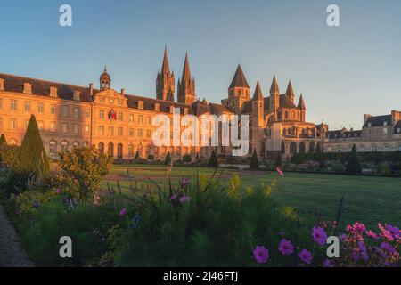 Caen, Normandy, France. Beautiful Abbey of Saint-Etienne or Abbaye aux Hommes and city hall at sunrise. former monastery. Popular tourist destination Stock Photo