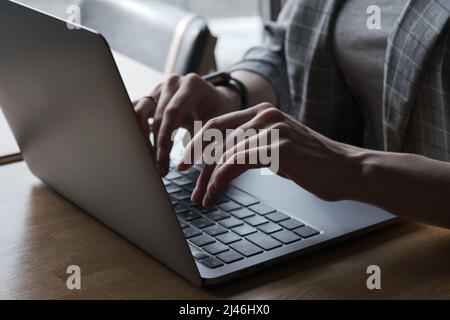 Hands typing on laptop keyboard Stock Photo
