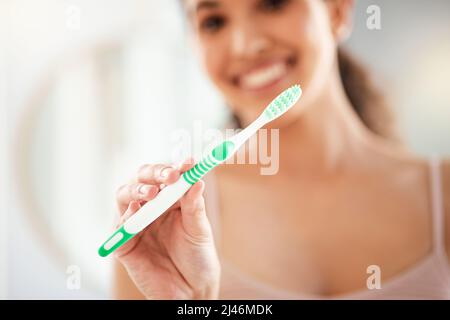 The best toothbrush. Shot of a young woman brushing her teeth at home. Stock Photo