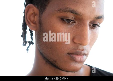A portrait of a pensive man against a white background Stock Photo