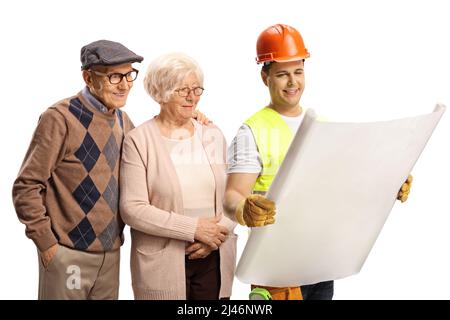 Construction worker showing a plan to an elderly couple isolated on white background Stock Photo