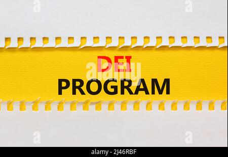 DEI diversity equity inclusion program symbol. Yellow paper with words DEI program on beautiful white background. Business DEI diversity equity inclus Stock Photo