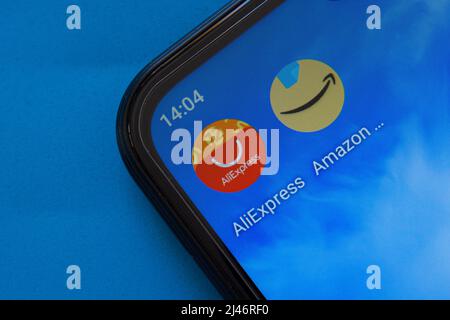 AliExpress and Amazon mobile application icons on smartphone screen. Popular online shopping apps. Afyonkarahisar, Turkey - April 10, 2022. Stock Photo