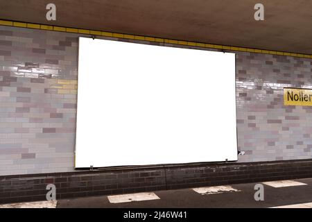 Empty advertisement board in an underground station. Blank mockup banner for the use as a template to preview ad design in public transportation area. Stock Photo