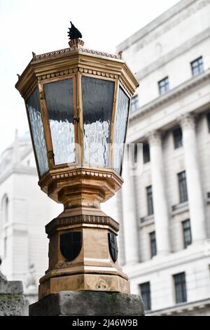 Large ornate brass lamp in the City of London outside the Mansion House, the official residence of the Lord Mayor of London Stock Photo