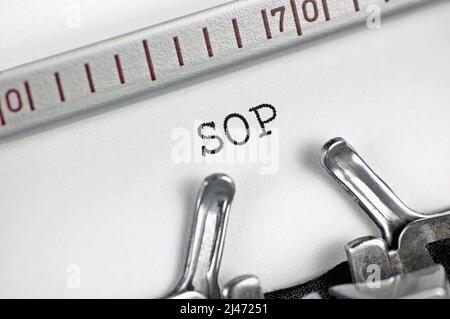 Standard / standing operating procedure acronym SOP text macro closeup, typewriter typed routine task instructions document concept for military Stock Photo