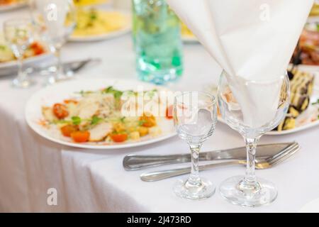 Table set for wedding or another catered event dinner. Concept: Serving. Celebration. Anniversary. Wedding Stock Photo