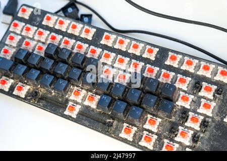 cleaning the computer keyboard with the keys removed Stock Photo