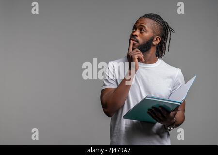 African American male student pondering over something Stock Photo