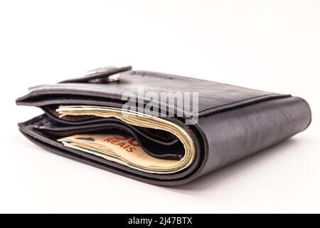 wallet full of money, isolated white background with copyspace, money from brazil Stock Photo