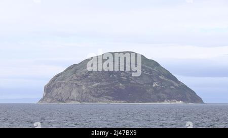 Ailsa Cragg is a remote island in the outer Firth of Clyde.  The island to the west of mainland Scotland is a popular destination for boat tours. Stock Photo