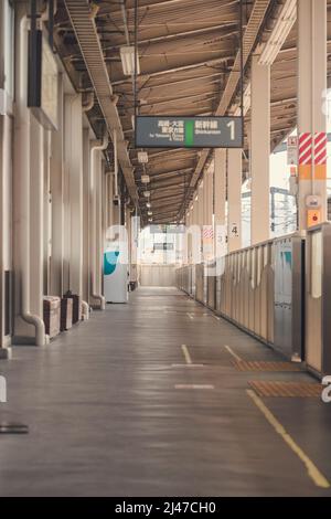 Waiting at an empty train station in the countryside in Japan Stock Photo