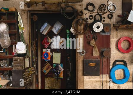 Old Tool Shed with Objects hanging from Wall Stock Photo
