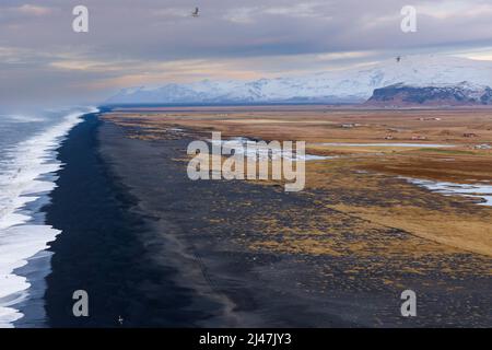 The endless black sand beach at Derholaye on the south coast of Iceland Stock Photo