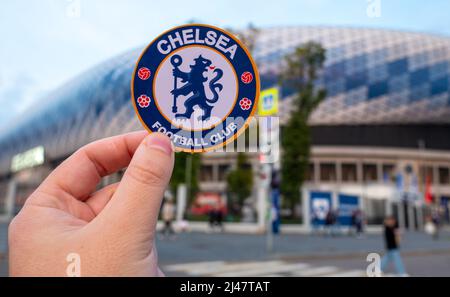 September 12, 2021, London, United Kingdom. The emblem of the Chelsea F.C. football club on the background of a modern stadium. Stock Photo