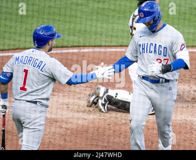 Chicago Cubs' Nick Madrigal, right, slides into second base next to San  Francisco Giants second baseman Thairo Estrada after Cubs' Seiya Suzuki  walked during the first inning of a baseball game in