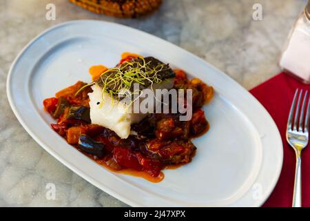 Cod confit with vegetable ratatouille on plate Stock Photo - Alamy
