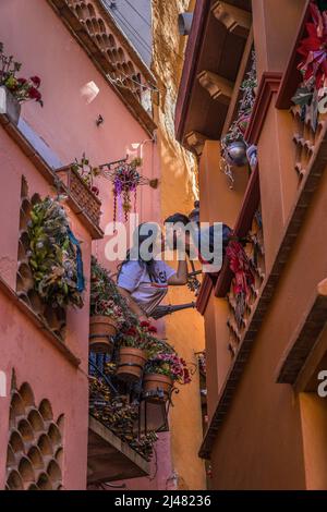 Quanajuato, Mexico - Dec 22, 2021. Kiss Alley Alleyway Colored Houses Guanajuato Mexico. Houses so close couple can exchange a kiss between balconies Stock Photo