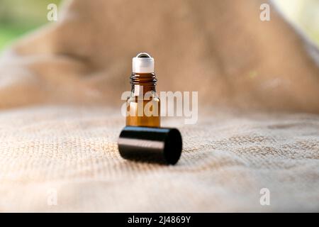 Blank amber glass bottle mockup with blank label various background. Medical, healthcare , skincare concept. Treatment and packaging design template. Stock Photo