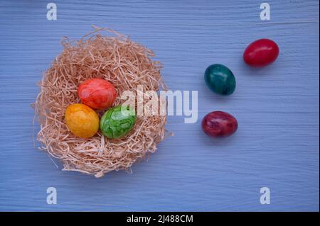Directly above shot of Easter eggs against the blue background Stock Photo