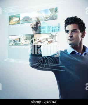 Photo manipulated shot of a young man using a theoretical digital interface..All screen content is designed by us and not copyrighted by others, and Stock Photo