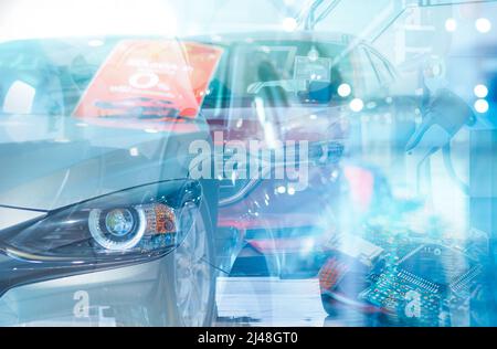 New EV car parked in showroom and electric car charging station for charge electric vehicle. EV charger. Commercial electric car charger. EV car. Stock Photo