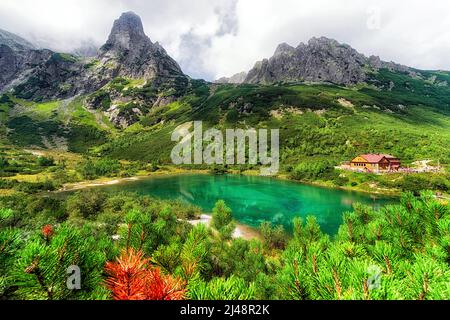 Tarn Zelene pleso and cottage in High Tatras mountains at Slovakia. Alpine summer mountainscape Stock Photo