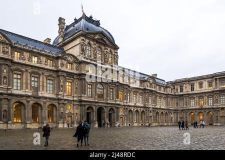 Urban landscape of a sunset at the Louvre Palace, an iconic building of the French state located on the Right Bank of the river Seine in Paris Stock Photo