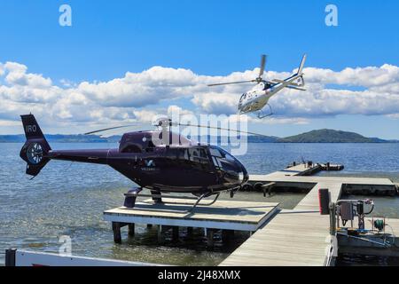 Helicopters of Volcanic Air (a tour company) at Lake Rotorua, Rotorua, New Zealand Stock Photo