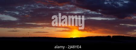 Breathtaking sunset with dramatic sky and clouds. Stock Photo