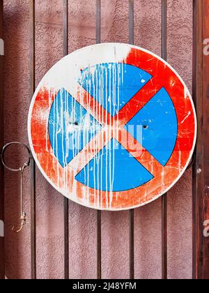 No stopping traffic sign with white paint spill mounted on the gate Stock Photo