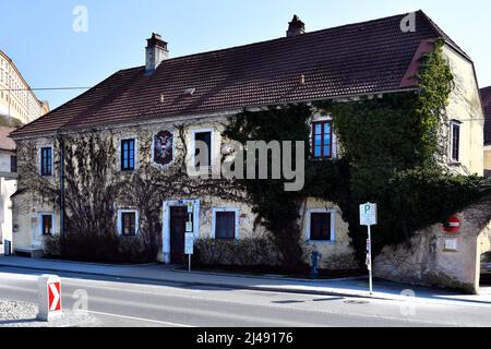 Melk, Austria - March 26, 2022: Bus station in front of  building from former post office in UNESCO world heritage site of Danube Valley Stock Photo