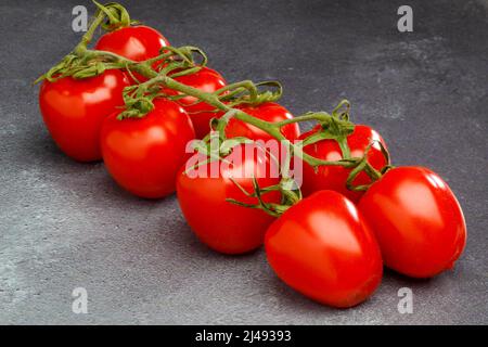 Vine Plum Tomatoes. Stock Photo